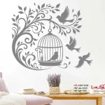 عکس برچسب دیواری شاخه خمیده با قفس پرنده