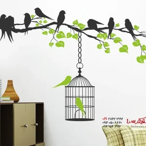 عکس برچسب دیواری شاخه دو رنگ با قفس پرنده